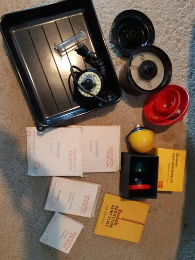 Omega enlarger. Darkroom equipment. Books.