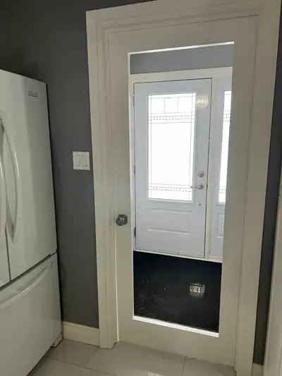 Interior glass door for sale. 32" opening. Painted white. Comes with a square brushed nickle door kn...