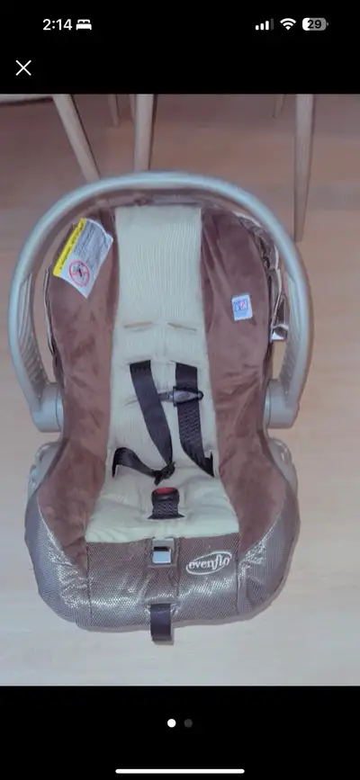 This is a used Evenflo car seat designed for safety and comfort, perfect for infants. Please note th...