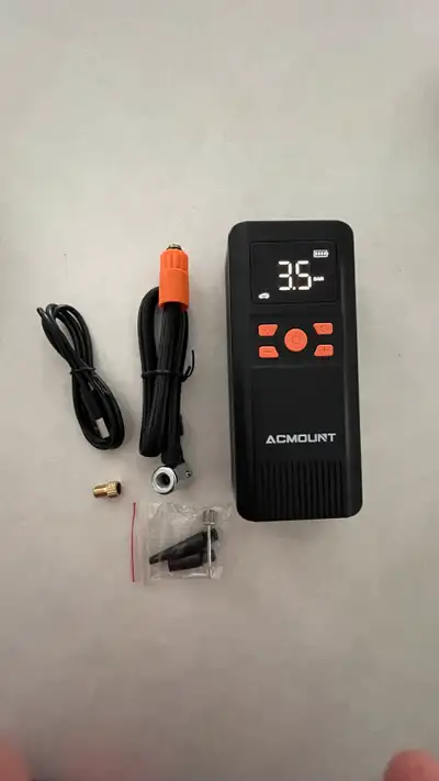 This is a brand new Acmount portable air compressor pump, perfect for keeping your tires properly in...