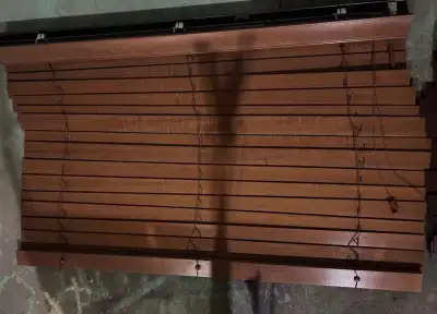 These are two Hunter Douglas wood blinds, each measuring 46 x 22.5 inches. They are in used conditio...