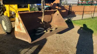 54"" tractor bucket Mounts 39 1/4" inside of the outside brackets. 33 3/4" outside of the inside bra...