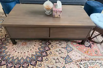A beautiful wooden coffee table from Stuctube with drawers. Price is negotiable.