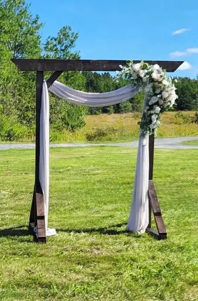 Wedding arch for sale. Walnut stained. Top board is 8 feet long. It’s 7 feet high. Legs are 5 feet a...