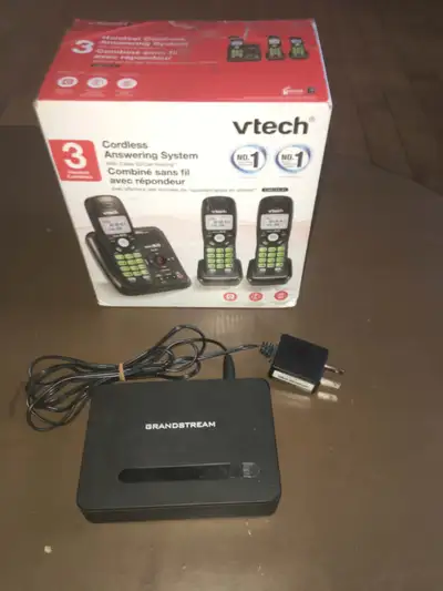 URGENT MOVING SALE ! We are selling Vtech 3 batteries wireless phones,with answering machine still b...