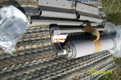 A&E slide topper c/w all mounting hardware. Brand new- Champagne color. Fabric is 166" long. This wi...
