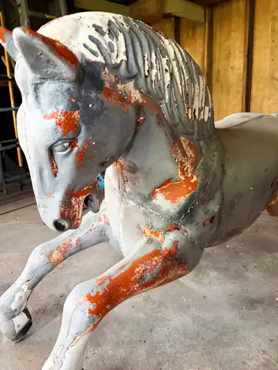 Rare mid-century kiddie ride horse from a 1950s dime-store or carnival ride. Heavy cast metal constr...