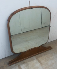 A vintage dresser top mirror