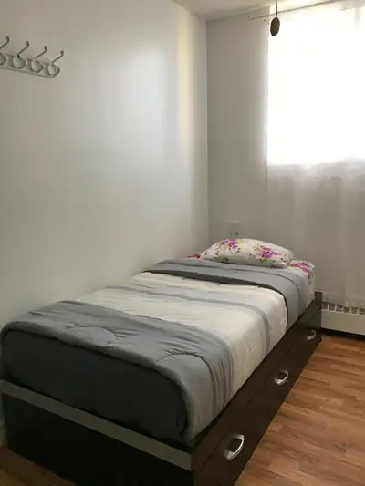 One furnished bedroom available in a quiet 4-bedroom home near the intersection of Lawrence Ave W an...