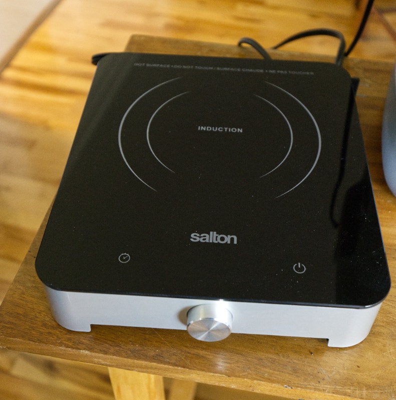 Surface de cuisson par induction et chaise de plage Pêche, camping et plein Air Laval/Rive