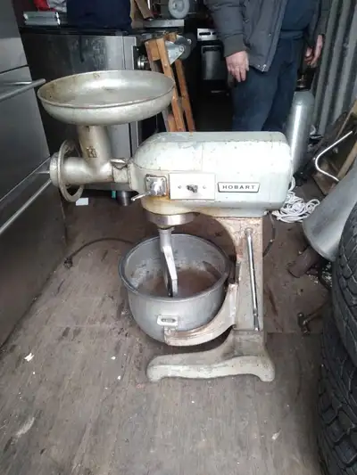 Hobart mixer in working condition. Comes with bowl, paddle, hook and meat grinder. $700.