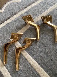 Cast metal furniture legs in gold 