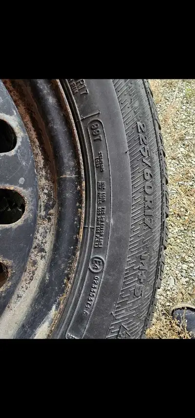 These are a set of used 225/60R17 winter tires mounted on steel rims, ready to get you through the s...