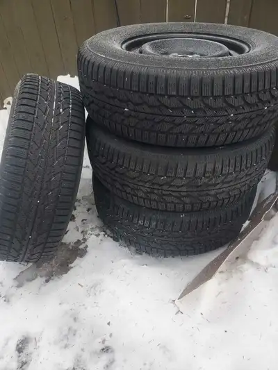 Firestone winter tires and rims for a Ford truck brand new tires and rims 2 months old 265/70R/17 6...