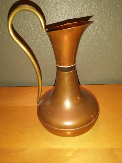 7" high vintage copper pitcher., View more