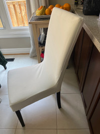 White faux leather chairs