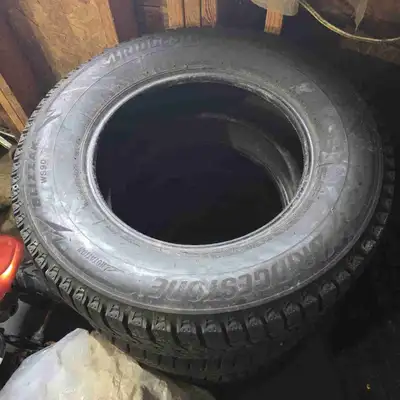 Set of 235/65R/16 Bridgestone blizzack tires for sale, very little use! Less than half a winter seas...