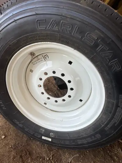 New 12 ply trailer tire and rim. Pick up in Melville.