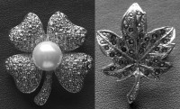 Silver-tone shamrock and maple leave brooch set