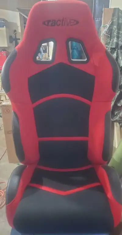 Brand new ractive racing seat drivers side, had it for a long time just never ended up using it, bra...