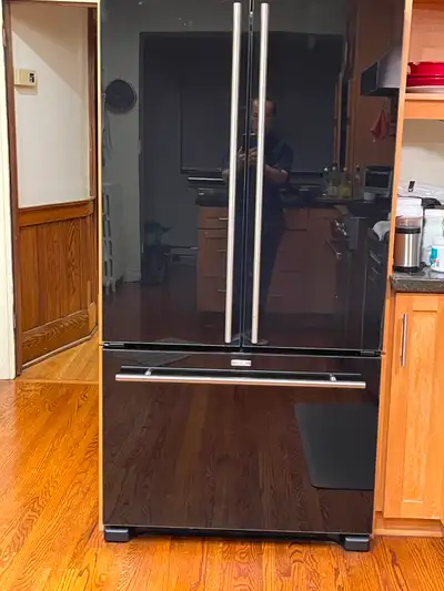 Black Jenn-Air Fridge for sale. The fridge is counter depth and is approximately 36" wide by 70" hig...