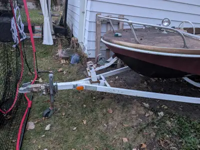 14-16ft fiberglass boat, as is. Trailer $500. Paid $1000.00