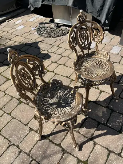 two cast iron decorative garden chairs, View more