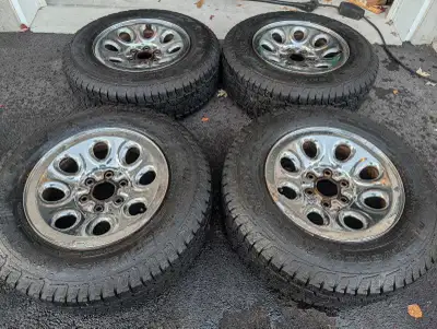 Cooper Discover Snow Claw Tires 245/70R17 Mounted on chrome rims from a Chevrolet Silverado. Bought...