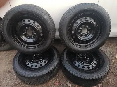 4 WINTER TIRES 215/60 R16 ON 5 X 114.3 STEEL RIMS LOTS OF TREAD