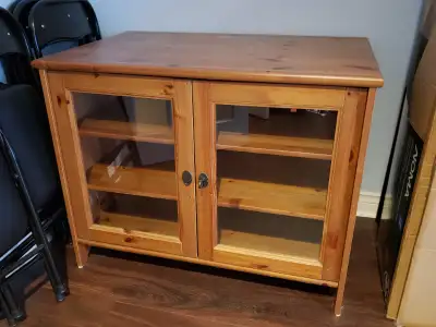Glass-fronted cedar display cabinet with locking doors
