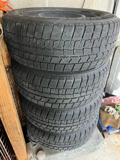 Dunlop snow tires with rims off Honda Civic. Size 215/55R/16 with 5x114.3mm bolt pattern and 64.1mm...
