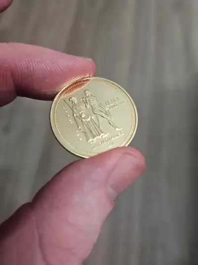 Celebrate a piece of Olympic history with this 1976 Canadian Olympic Gold Coin, a distinguished coll...