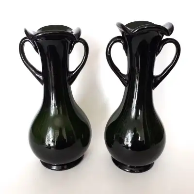 Pair of 10" tall green glass urn style vases. Very good vintage condition. There are some bubbles in...