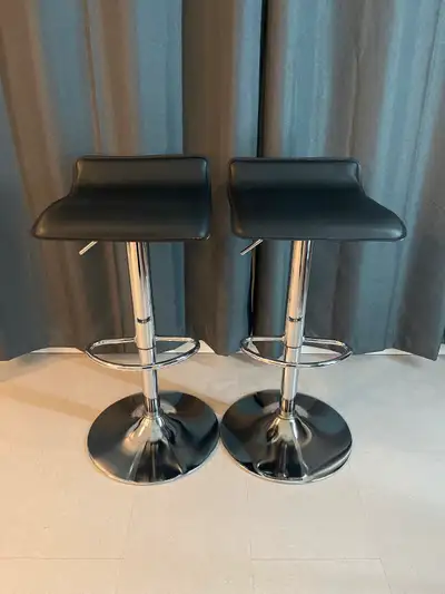 Moving to another province so I am downsizing my furniture. Selling 2 black adjustable bar stools. S...
