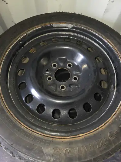 Set of four winter tires on rims. Removed from a Kia Optima; compatible with some Hyundai vehicles a...