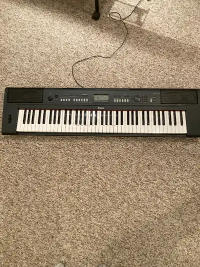 Yamaha electric keyboard with stand