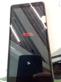 TCL BRAND NEW COMED WITH A  32 GB SD CARD