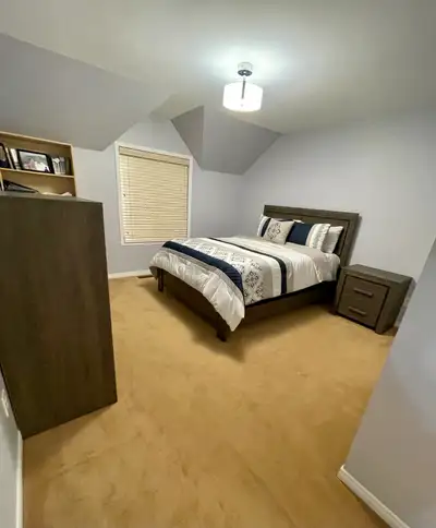 Clean and spacious room available with an en suite private bathroom, large closet, and AC/heat, hydr...