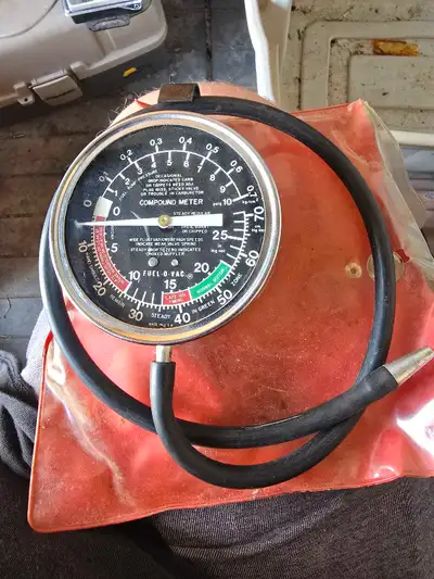 This used Compound Meter is designed to measure pressure, fuel, and vacuum in automotive systems, ma...