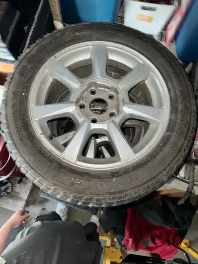 Durable Goodyear Eagle Ultra Grip winter tires come mounted on silver multi-spoke alloy rims. Tire s...