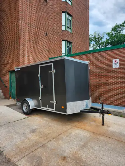 2022 enclosed trailer. Hardly used. Like new. One owner. Comes with ownership. Led lights. 15 inch w...