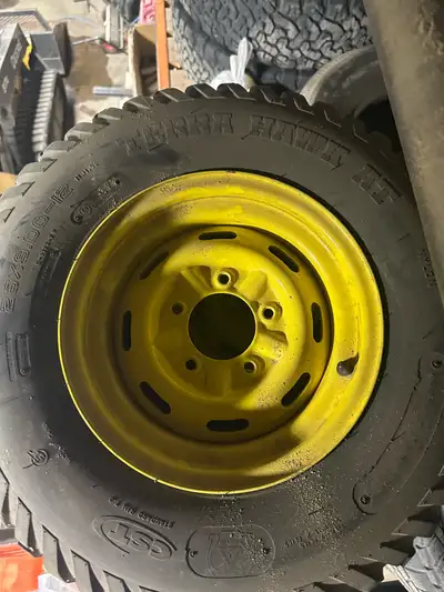 John Deere 835M XUV Gator - Factory Rims & Tires. ($350) -Set of four. -Rims and tires have approxim...