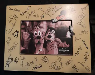 Add a touch of Disney magic to your space with this 4x6 inch photo frame, adorned with printed autog...