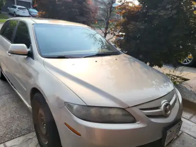 2007 Mazda 6 wagon AS=IS wheel arch rusted missing small piece of exhaust so loud. Door swich on pow...
