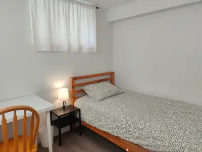 Private furnished room in a shared basement apartment (with 2 female students) with separate entranc...