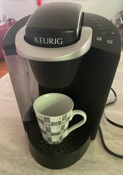 Brew your perfect cup with this Keurig coffee machine. It's in used condition, but works perfectly f...