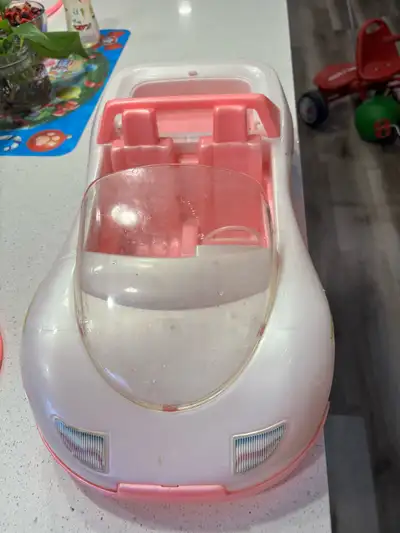 Zoom into fun with this Barbie Car! This is a used Barbie car, ready for countless adventures. The c...