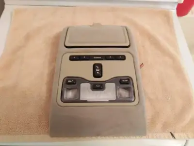 The Jaguar XJ6 1995-1997 Interior Overhead Map Lighting and Sun Roof Control Console is a beige-colo...