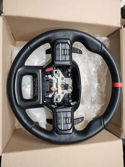 Selling a steering wheel assembly from a 24 F150 raptor fits many other years. Leather damaged at th...