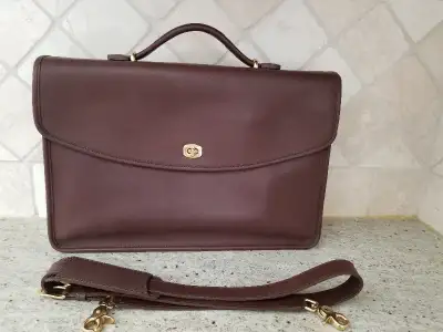 Like new, used twice. Leather shoulder strap included. Turn lock. Located in Georgetown.